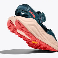 Blue sandal with red sole on a white background