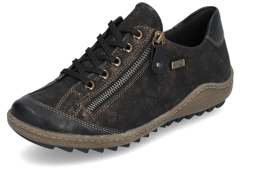 A dark brown textured slip-on sneaker with black laces, a side zipper, and a rugged brown sole, shown on a white background.